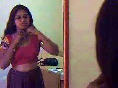 Here Is A Sexy And Young Indian Hooker Dressing Up
